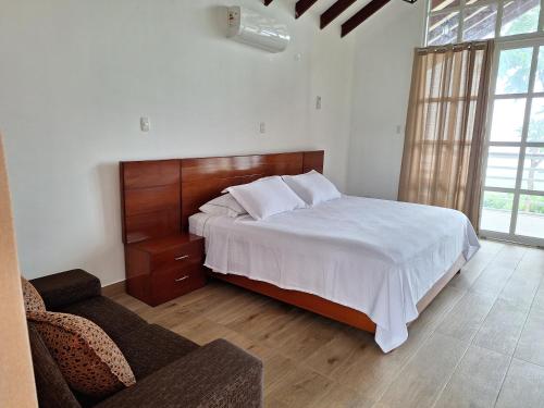 Кровать или кровати в номере Bungalows Las Brisas de Pacchilla