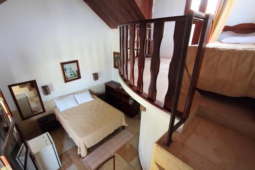 Una cama o camas en una habitación de Pousada Vale do Luar