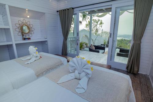 Katil atau katil-katil dalam bilik di The Puncak Private Villa