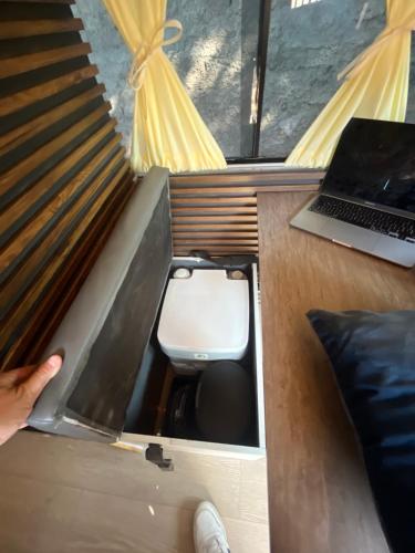 a room with a laptop and a toilet in it at CamperVan totalmente equipada - CasaRodante - MotorHome in Santiago