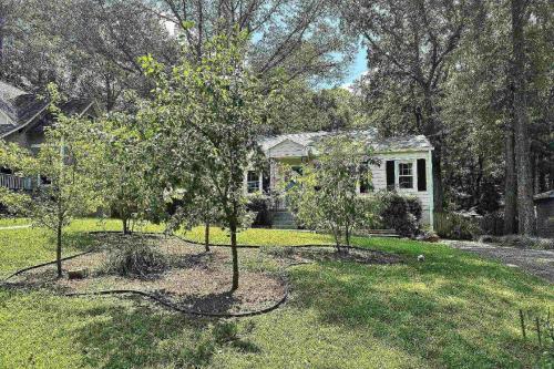 a small white house with trees in the yard at Oldfield Escape in Decatur