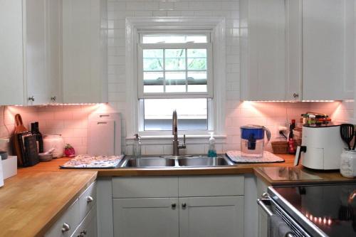 a kitchen with a sink and a window at Oldfield Escape in Decatur