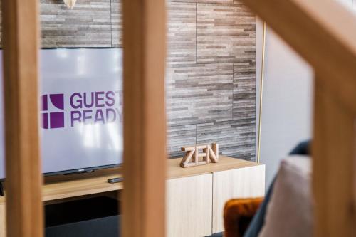 a living room with a tv and a window at GuestReady - Tranquil Hideaway near Funchal in Funchal