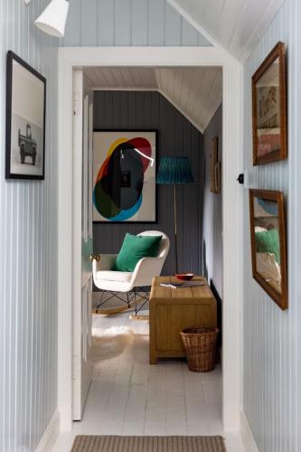 a living room with a chair and a table at Cuttieshillock in Banchory