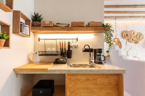 a kitchen with a sink and a counter at Marabou Unique Stay in Thessaloniki