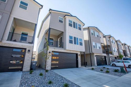 a row of apartment buildings with a garage at Canyon Escape Luxury Ski home American Fork in American Fork