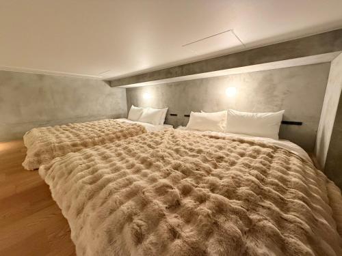 Postel nebo postele na pokoji v ubytování Hotel Ten Tamachi