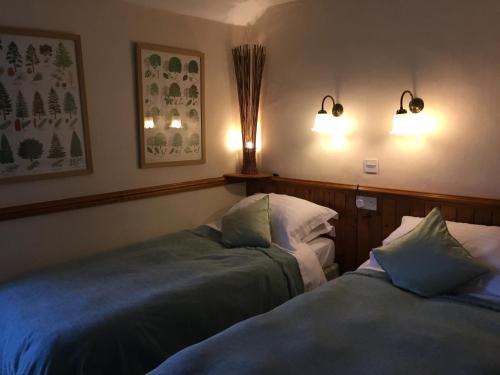 A bed or beds in a room at The Bull Inn West Tanfield 