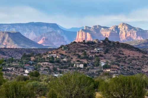 a view of the grand canyon with mountains in the background at Hikers Retreat with Furnished Patio in Rimrock! in Rimrock