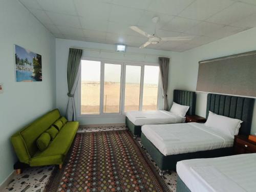 Postel nebo postele na pokoji v ubytování Sea Breeze Lodge