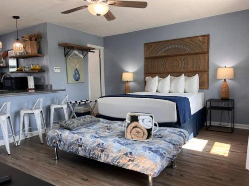 a hotel room with a bed and a table and chairs at The Mark at Surfside #6 in Surfside Beach