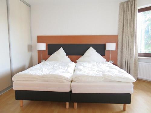 Ένα ή περισσότερα κρεβάτια σε δωμάτιο στο Appartementresidenz am Kurpark