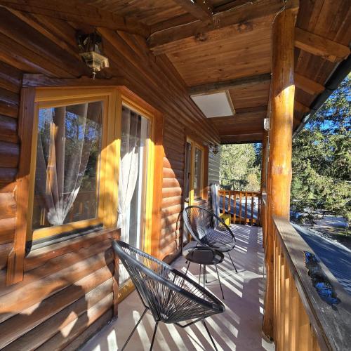 two chairs on a porch of a cabin at Trebevićki Raj 1 in Brus