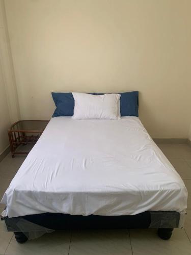 Ένα ή περισσότερα κρεβάτια σε δωμάτιο στο Acogedor Depa Céntrico Ideal para Familias