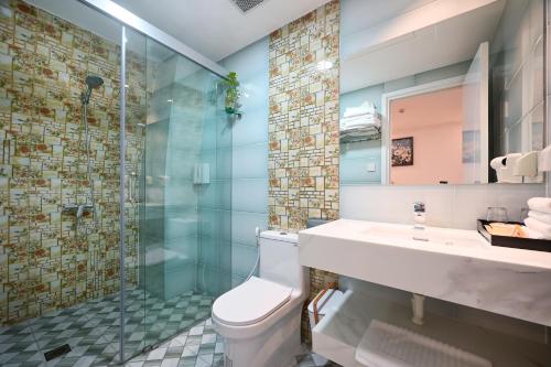 a bathroom with a toilet and a sink and a shower at Ly Ly Hotel 2 Binh Tan District in Ho Chi Minh City