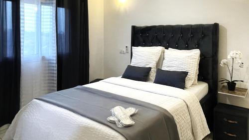 Postel nebo postele na pokoji v ubytování RESIDENCE HMR Douala - Lendi