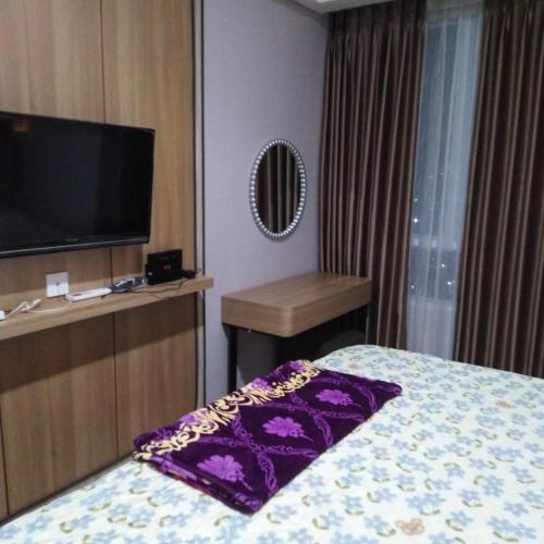 Katil atau katil-katil dalam bilik di The Bay Apartemen Lampung