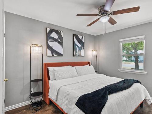a bedroom with a bed and a ceiling fan at Casa Noa in Euless