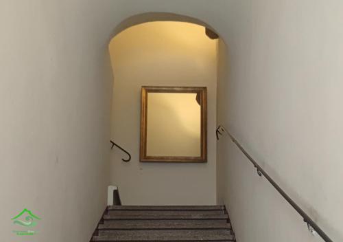 a stairway with a mirror on the wall and a stair case at Scariceddu Etna Sea Guest House 2 in Riposto