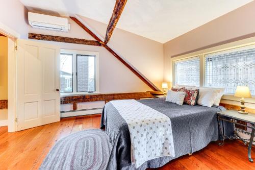 a bedroom with a bed and two windows at Outdoor Fireplace and Pool Table Tamworth Home! in Tamworth