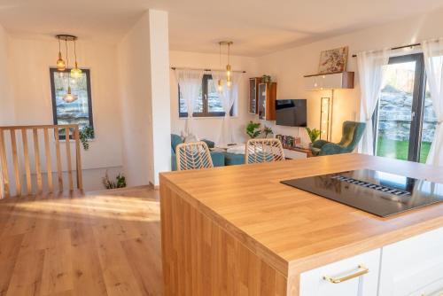 a kitchen and living room with a counter top at Höhenweg Appartement & Ferienwohnung in Mariapfarr