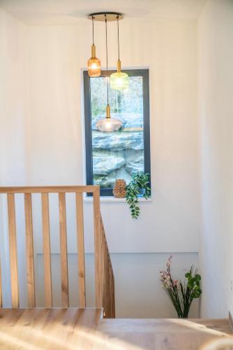 a staircase in a home with a window at Höhenweg Appartement & Ferienwohnung in Mariapfarr