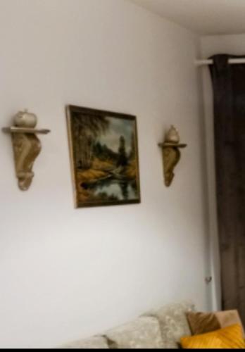 a living room with a painting on a wall at Siame in Drama