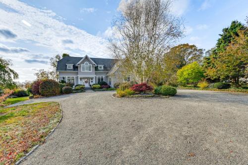 a large white house with a driveway at Groton Home Less Than 1 Mi to Beach on Long Island Sound! in Groton