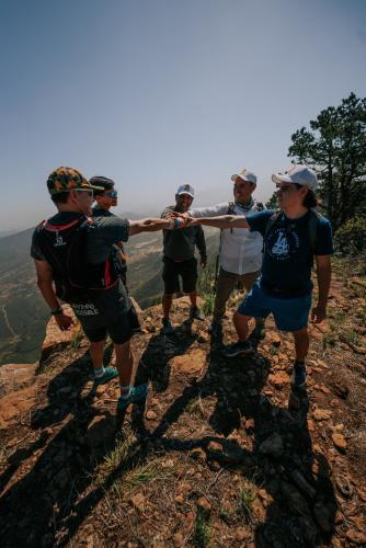 a group of people standing on top of a mountain at Wander Cabins, Cabaña con Vista Única a la Sierra de Artega in Arteaga