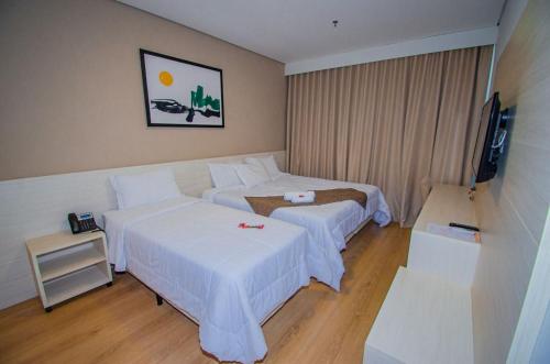 Ένα ή περισσότερα κρεβάτια σε δωμάτιο στο Hotel Recanto Maestro
