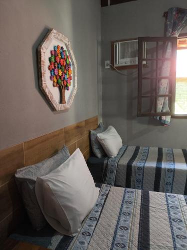 Cama o camas de una habitación en Pousada Casa do Bosque