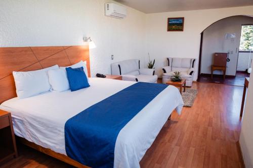 Una cama o camas en una habitación de Hotel Del Angel, Apizaco