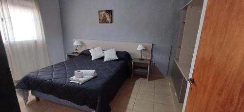Ένα ή περισσότερα κρεβάτια σε δωμάτιο στο Cabañas Lo de Luis