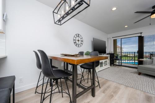 a dining room with a table and chairs at Gulf Side Townhomes 20 condo in Gulf Shores