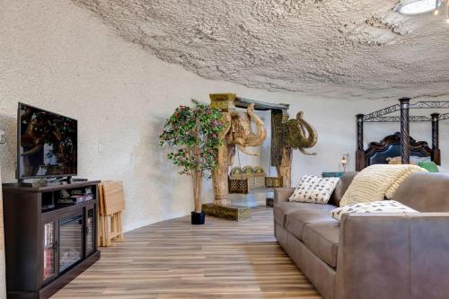 a living room with a couch and a tv at Adults Only - Secluded Mountainside Dome Retreat in Stanley