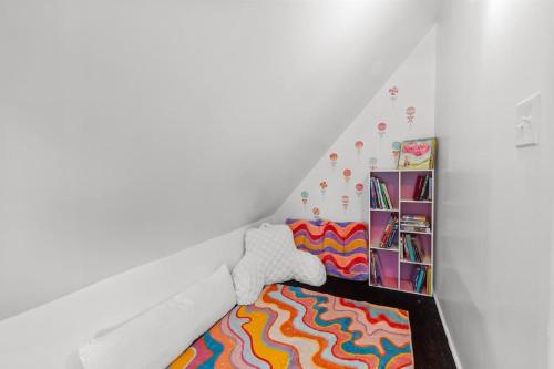 a room with a bed and a book shelf at Sweet Retreat in Frankfort
