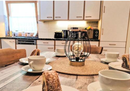 a kitchen with a table with cups and a blender at Apartment Wandegg im Bergsteigerdorf Ginzling Mayrhofen in Mayrhofen