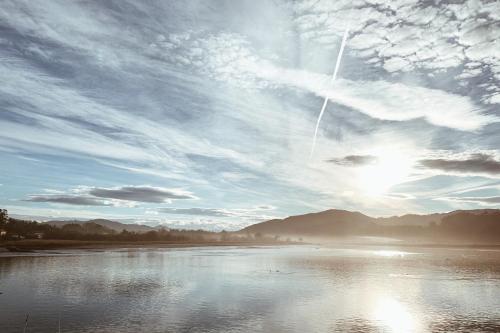 a view of a body of water with a cloudy sky at Estudio 33 in San Juan de la Arena