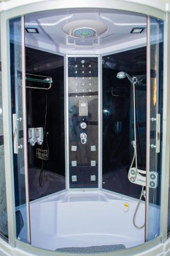 a view of the inside of a shower in a room at Dej's Luxury Apartment House in Lekki