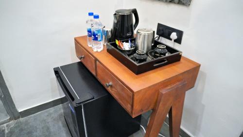 a wooden table with a counter top with a stove at Madri Retreat - Heritage Boutique Hotel with Pool in Udaipur
