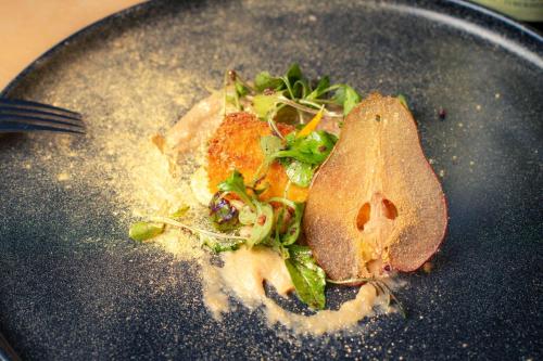 a plate with a piece of food on it at Estérel Resort in Esterel