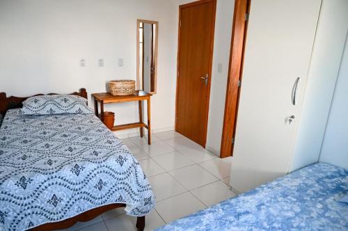 Ein Bett oder Betten in einem Zimmer der Unterkunft Chale Ville Maramar 401