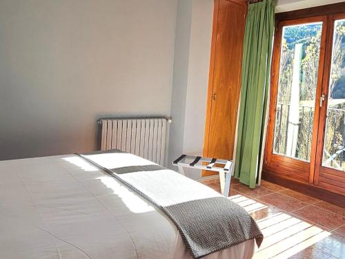 a bedroom with a large bed and a window at Apartaments Bonet in Pal
