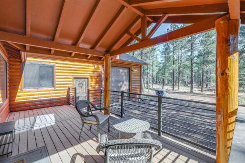 a porch of a cabin with a table and chairs at Furnished Gazebo with View Rustic Williams Retreat! in Williams