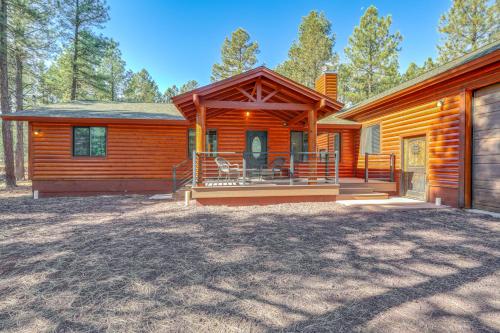 a log cabin with a porch and a deck at Furnished Gazebo with View Rustic Williams Retreat! in Williams