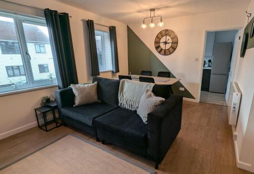 a living room with a couch and a table at 2 Bedroom apartment in Brean in Brean