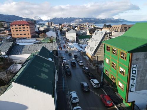 an aerial view of a city with cars on a street at YAGHAN HOSTEL in Ushuaia