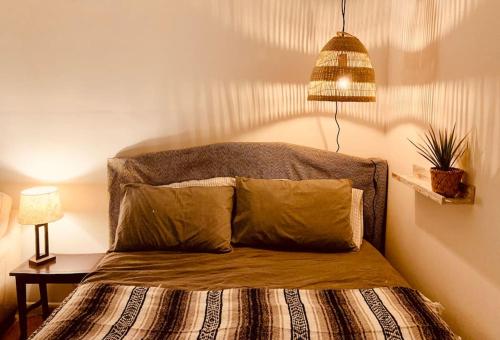 a bed with two pillows on it in a bedroom at Oceanfront Studio in Fort Lauderdale in Pompano Beach