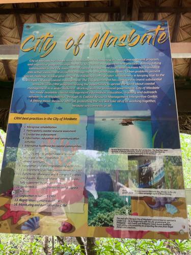 a sign for a city of muncie with an aquarium at Maria Kulafu Lodging House Pier site- Santa Clara office 2nd Floor in Cagba