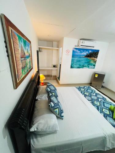 Postel nebo postele na pokoji v ubytování Limsor Apartahotel